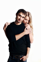 Young love couple smiling. Over white background