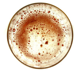 Top view on glass of beer on white background