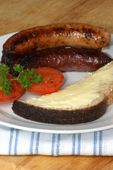 grilled pork sausages, tomato and toast bread