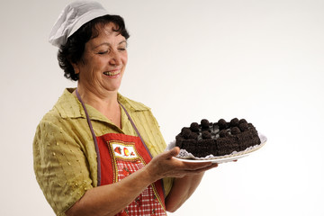 grandmother showing her chocolate cake
