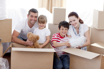 Family moving home with boxes around