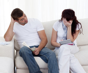 Couple doing their bills in recession times