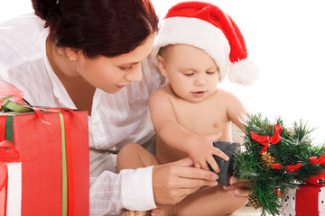 baby and mother with christmas gifts