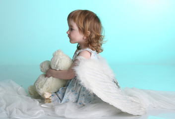 A little (three year old) girl with angel wings