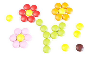Candy flowers. Many colourful candy filling background.