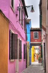 Colorful alley in Burano, Italy.