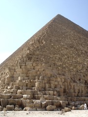 Egypt - Pyramid of Cheops in Giza against blue sky background