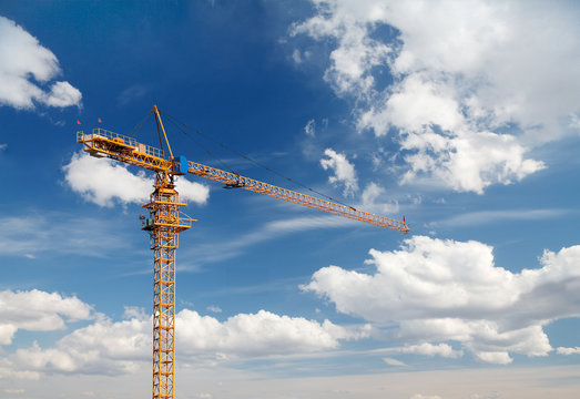 yellow crane on blue sky