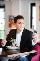 Man with Salad and Phone