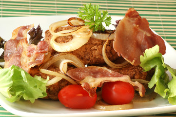 rissole with grilled bacon and onion on a plate