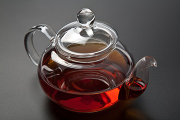 glass teapot with black tea
