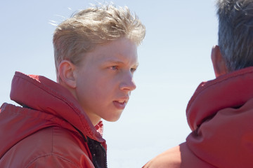 Father and Son with red Floatation Suits