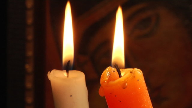candles and old Christian Orthodox icon