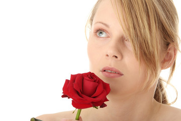 Beautiful young woman with red rose