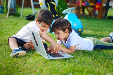 Fototapeta premium Children on laptop, outdoor