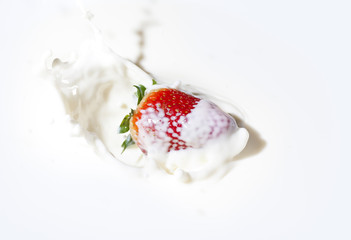 Strawberry with cream splashes