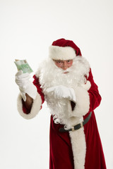 Weihnachten,Weihnachtsmann mit Geld in der Hand
