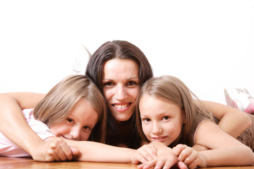 young beautiful mother and her two little daughters