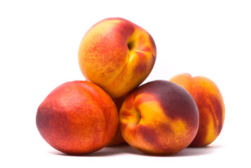 Juicy nectarines on a white background
