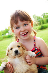 Gorgeous , happy girl with a dog