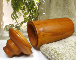 hand carved wooden vessel in a spa environment