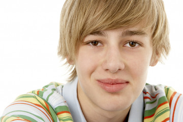 Studio Portrait Of Smiling Teenage Boy