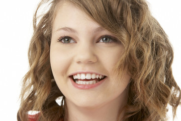 Studio Portrait Of Smiling Teenage Girl