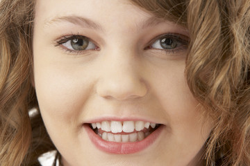 Studio Portrait Of Smiling Teenage Girl