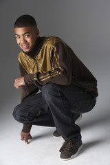 Studio Portrait Of Fashionably Dressed Teenage Boy
