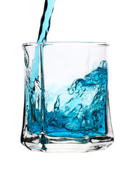 Cool blue drink is being poured into glass