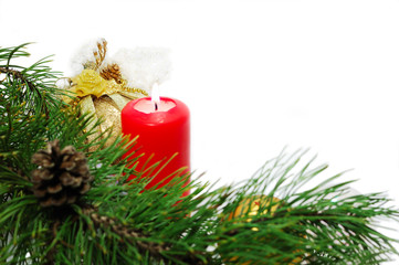Christmas decoration with a pine branch, candle and balls