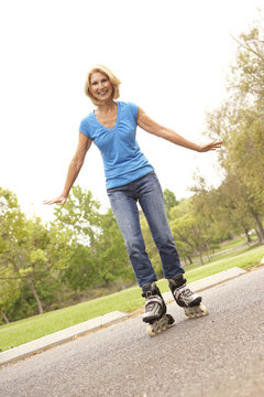 Senior Woman Skating In Park