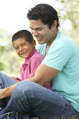 Fototapeta premium Father And Son In Park