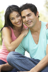 Portrait Of Young Couple In Park