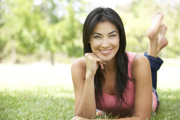 Portrait Of Young Woman In Park