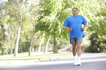Senior Man Jogging In Park