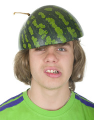 Teenager in a cap from a water-melon