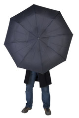 Man hiding behind a black umbrella (isolated on white)