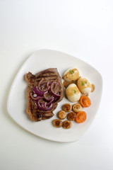 grilled rump steak and bacon with organic vegetable