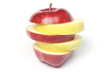 Fototapeta na wymiar Sliced two-colour apple, isolated on white