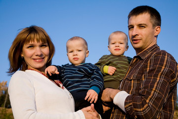 Fototapeta premium Parents with young twins