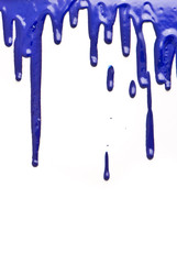 Blue paint pouring on white background
