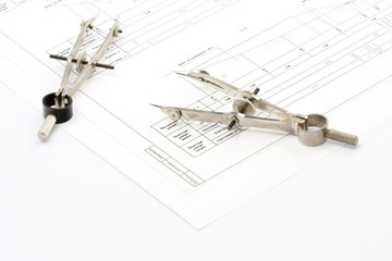 Tools of the designer on the drawing isolated on white backgroun