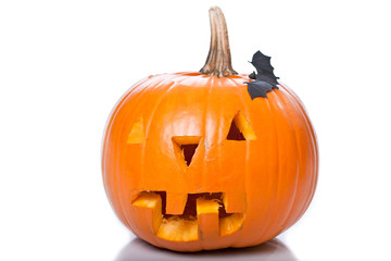 Jack-o-lantern with bat isolated on white