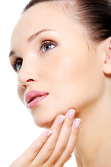 Attractive female face in skincare treatment concept