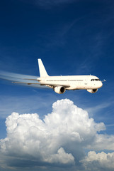 Fototapeta na wymiar Fast airplane in the sky