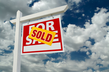 Sold For Sale Real Estate Sign on Clouds