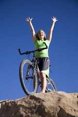 Fototapeta na wymiar Woman on bike happy