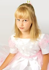 Portrait of a girl in a dress for first communion