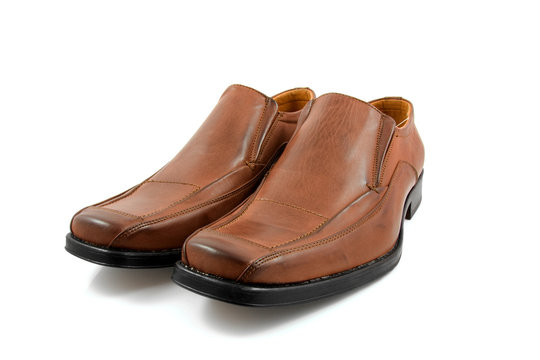 Pair of brown male business shoes over white background